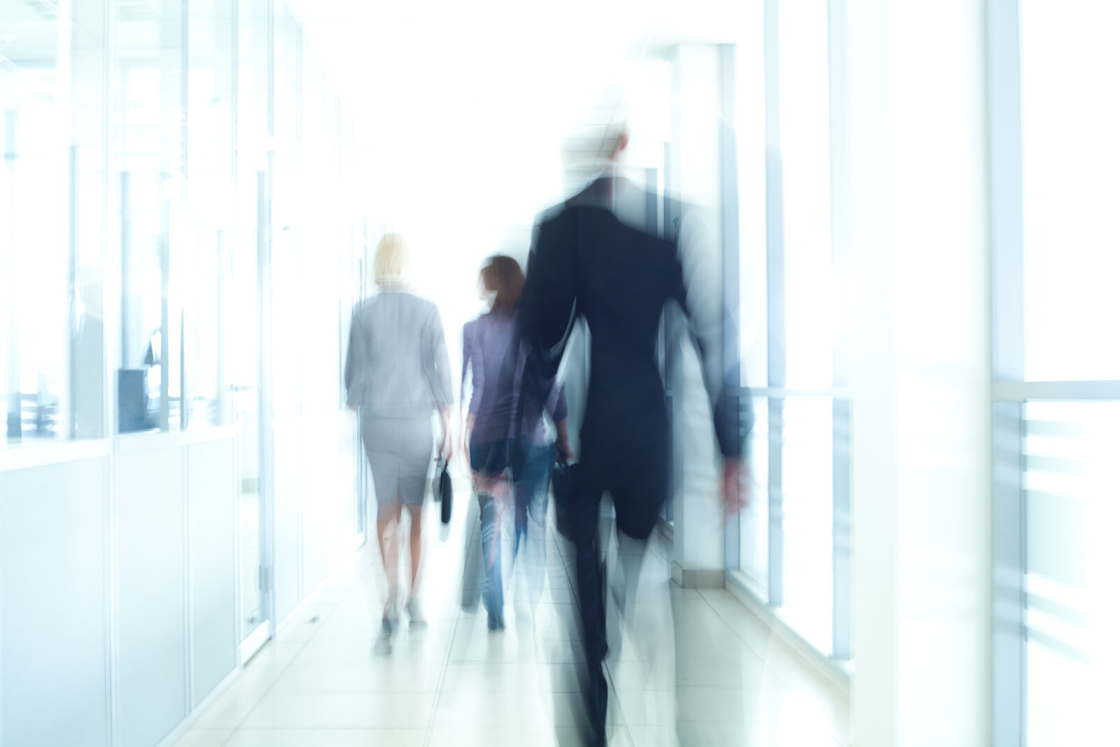 Business people walking in business centre