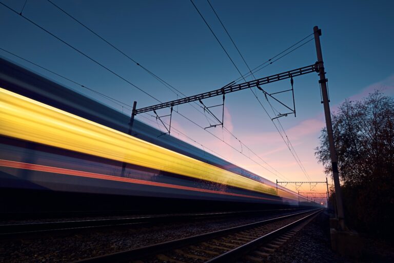 Railway At Beautiful Dawn Long Exposure Of Train On Railroad