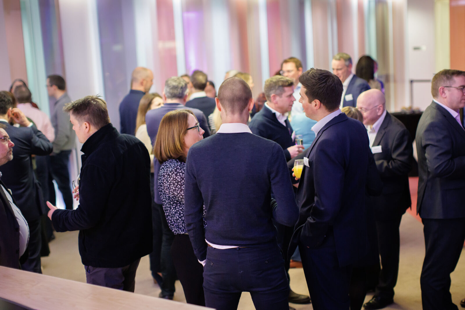 group of people in conversation at an office event